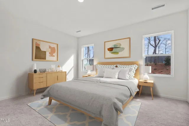 a bedroom with a bed and a desk