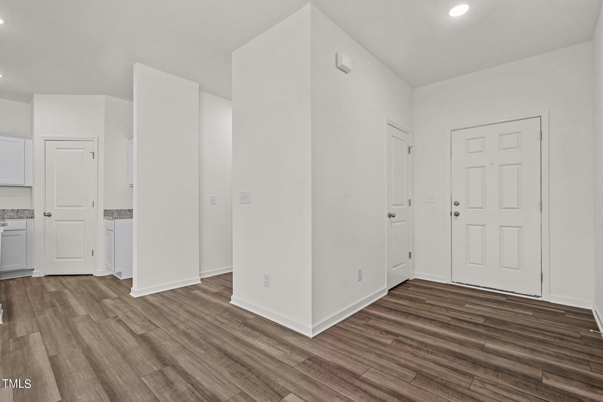 84 Club Road Louisburg, NC 27549 - Photo 2 of 28 a view of a room with wooden floor