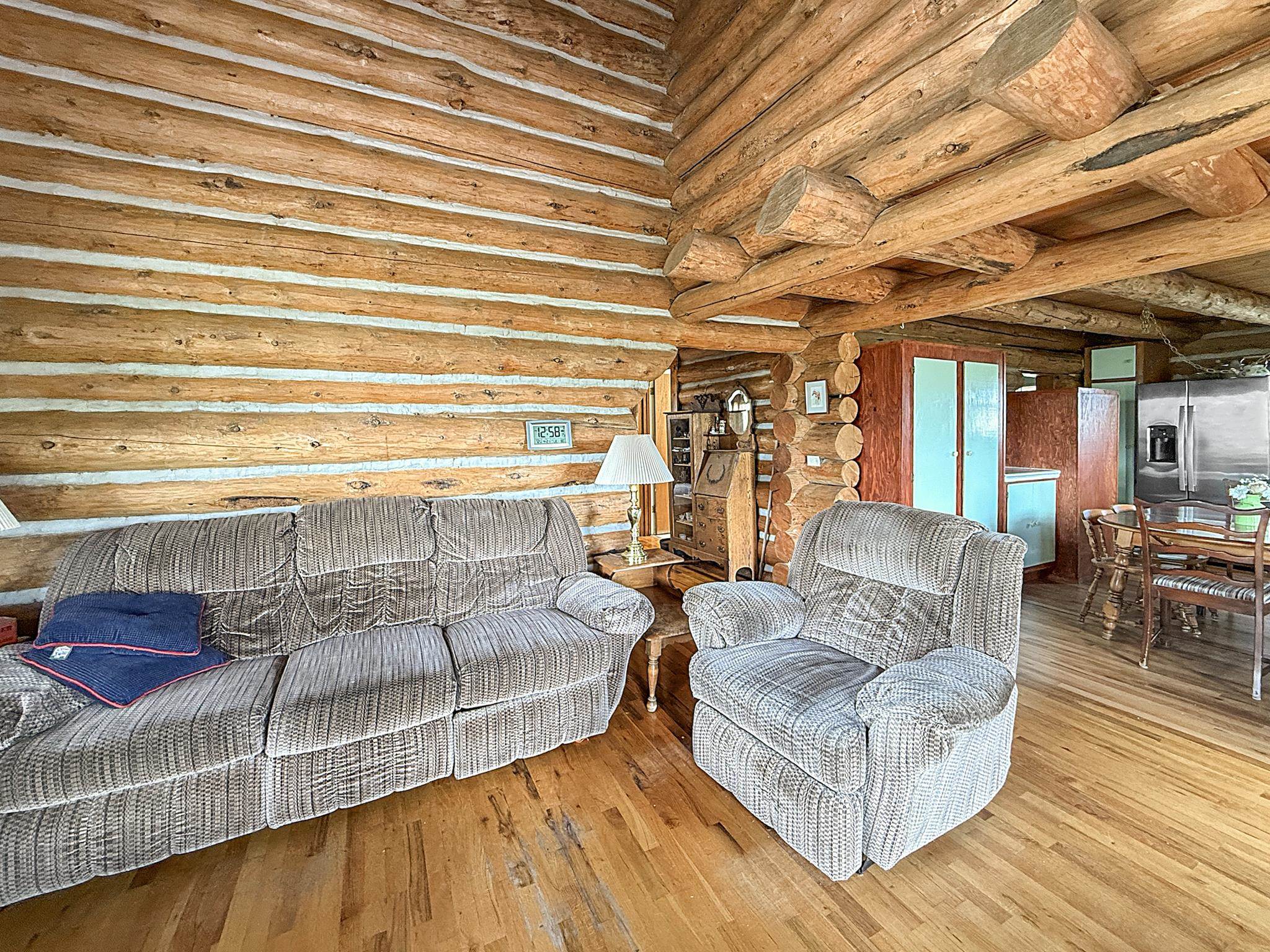 9709 3605 Road Hotchkiss, CO 81419 - Photo 36 of 42 a living room with furniture and a wooden floor