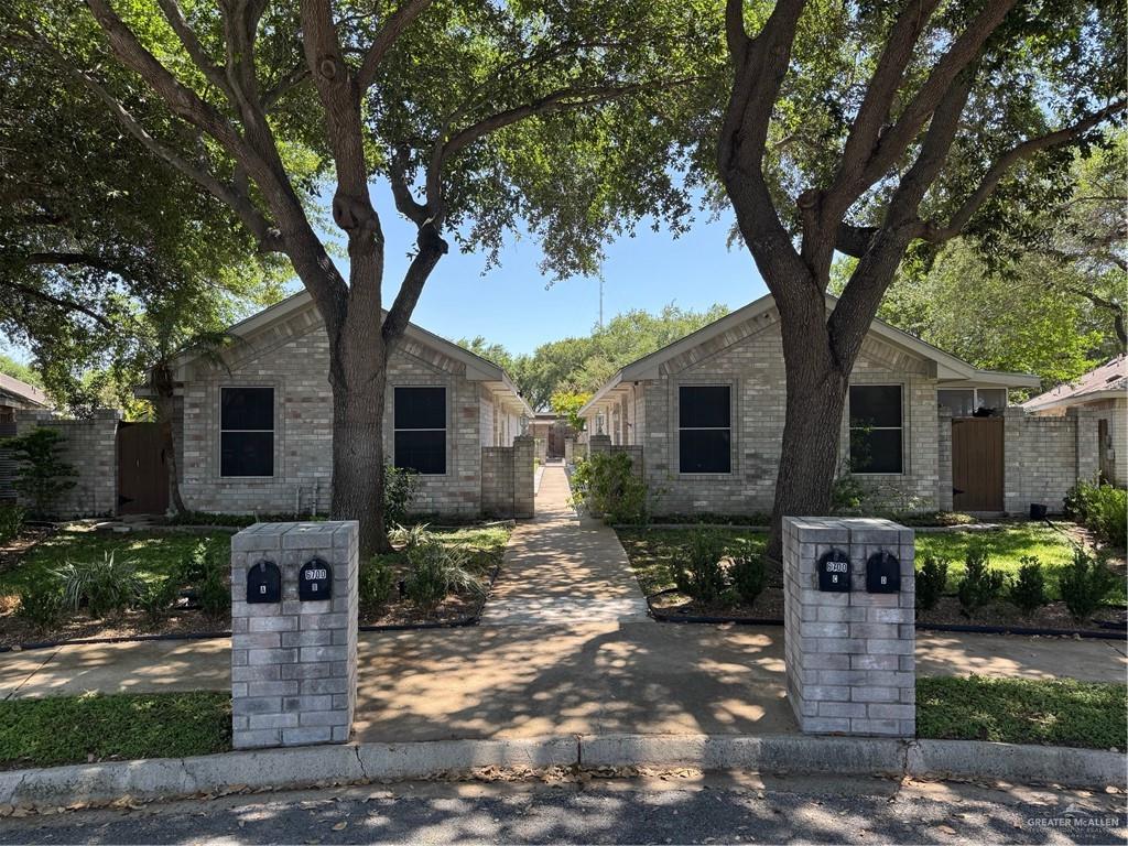 6700 North 8th Street McAllen, TX 78504 - Photo 2 of 16 a front view of a house with garden and plants
