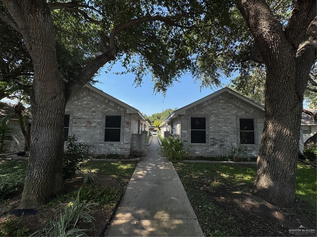 6700 North 8th Street McAllen, TX 78504 - Photo 3 of 16 a front view of a house with yard