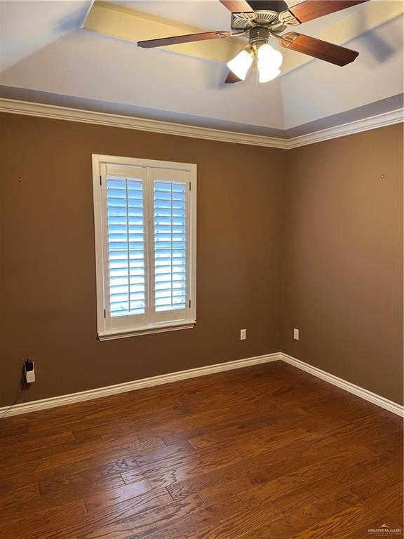 6700 North 8th Street McAllen, TX 78504 - Photo 5 of 16 a view of an empty room with wooden floor and a window