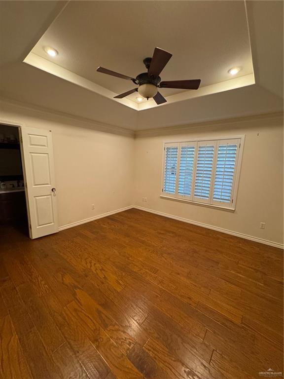 6700 North 8th Street McAllen, TX 78504 - Photo 10 of 16 a view of an empty room with window and wooden floor