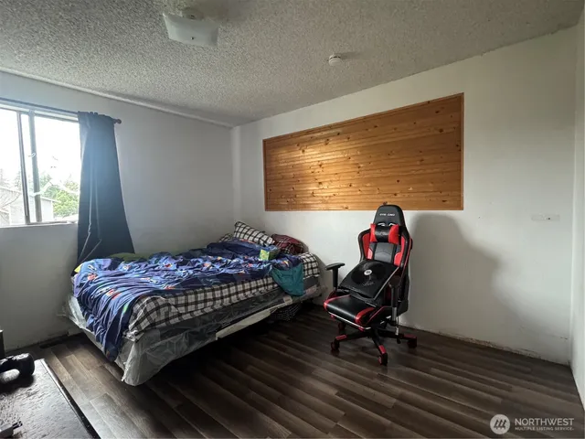 a bedroom with bed and a window