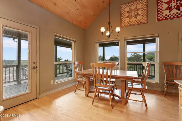 a kitchen with kitchen island granite countertop wooden cabinets and a refrigerator