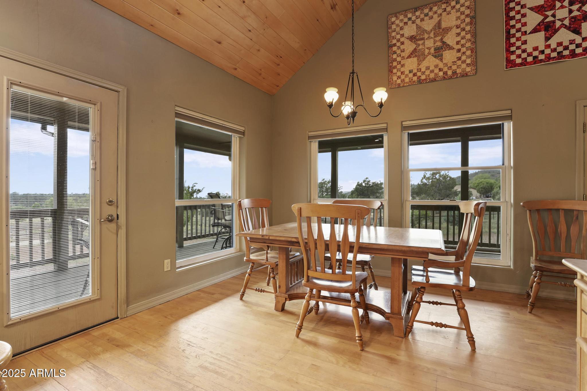131 West Hunt Ranch Road Pine, AZ 85544 - Photo 11 of 65 a dining room with furniture and wooden floor