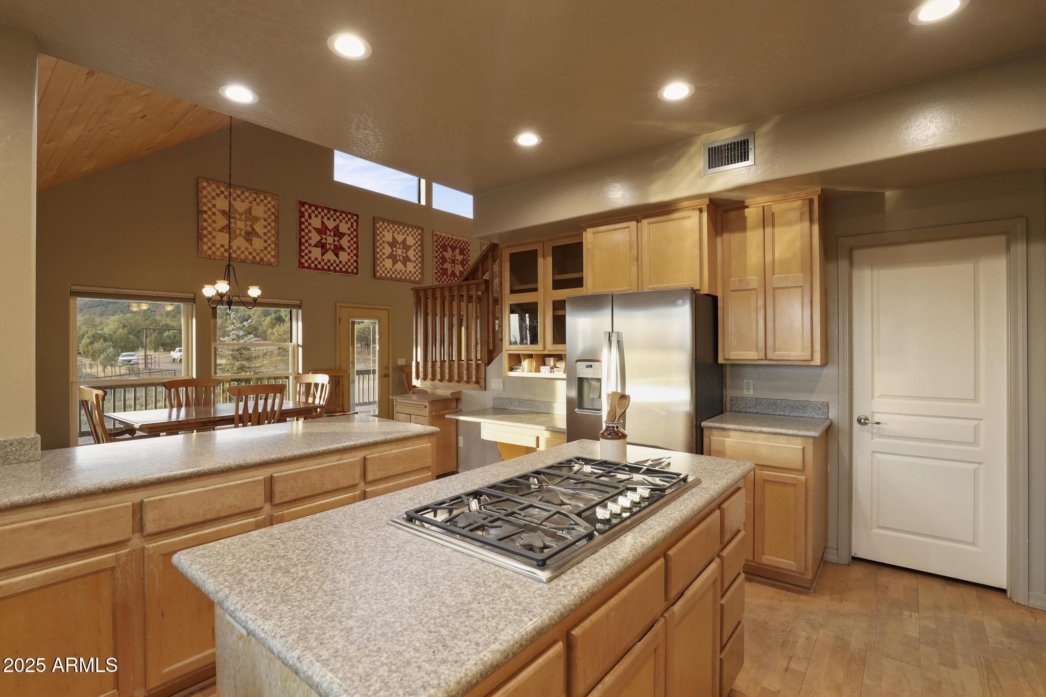 131 West Hunt Ranch Road Pine, AZ 85544 - Photo 13 of 65 a kitchen with a stove a refrigerator and cabinets