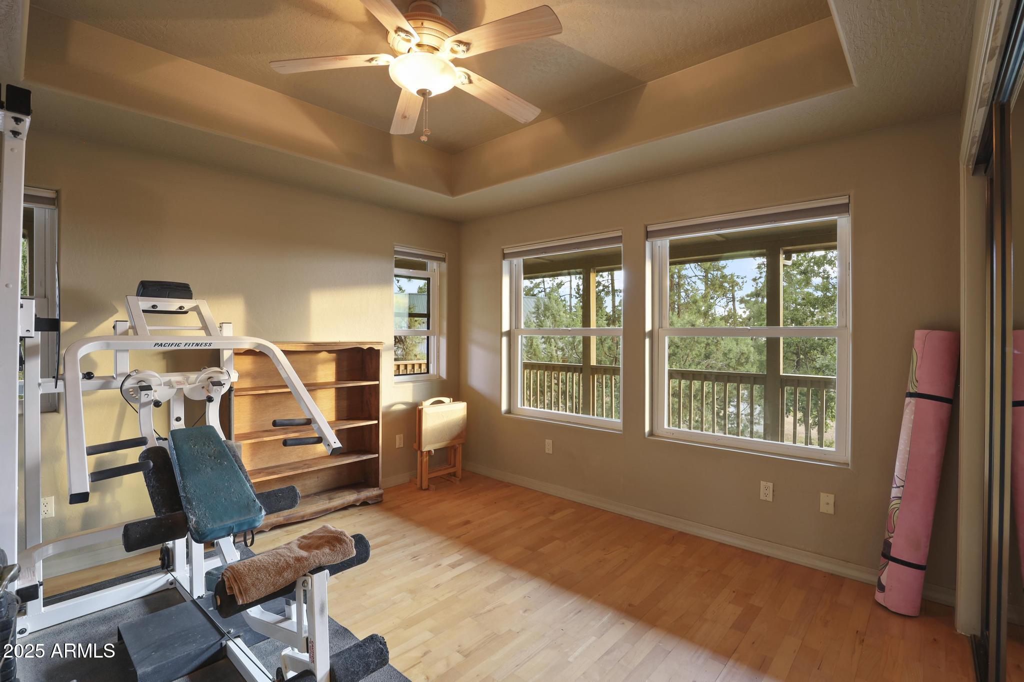 131 West Hunt Ranch Road Pine, AZ 85544 - Photo 15 of 65 a view of a workspace with furniture and a window