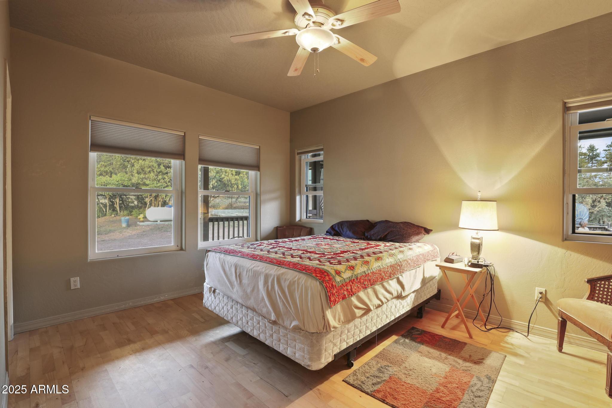 131 West Hunt Ranch Road Pine, AZ 85544 - Photo 16 of 65 a bedroom with a bed and window