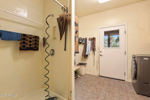 a view of a chairs and table in the balcony