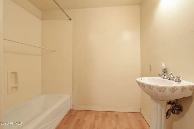 a view of workspace with furniture window and wooden floor