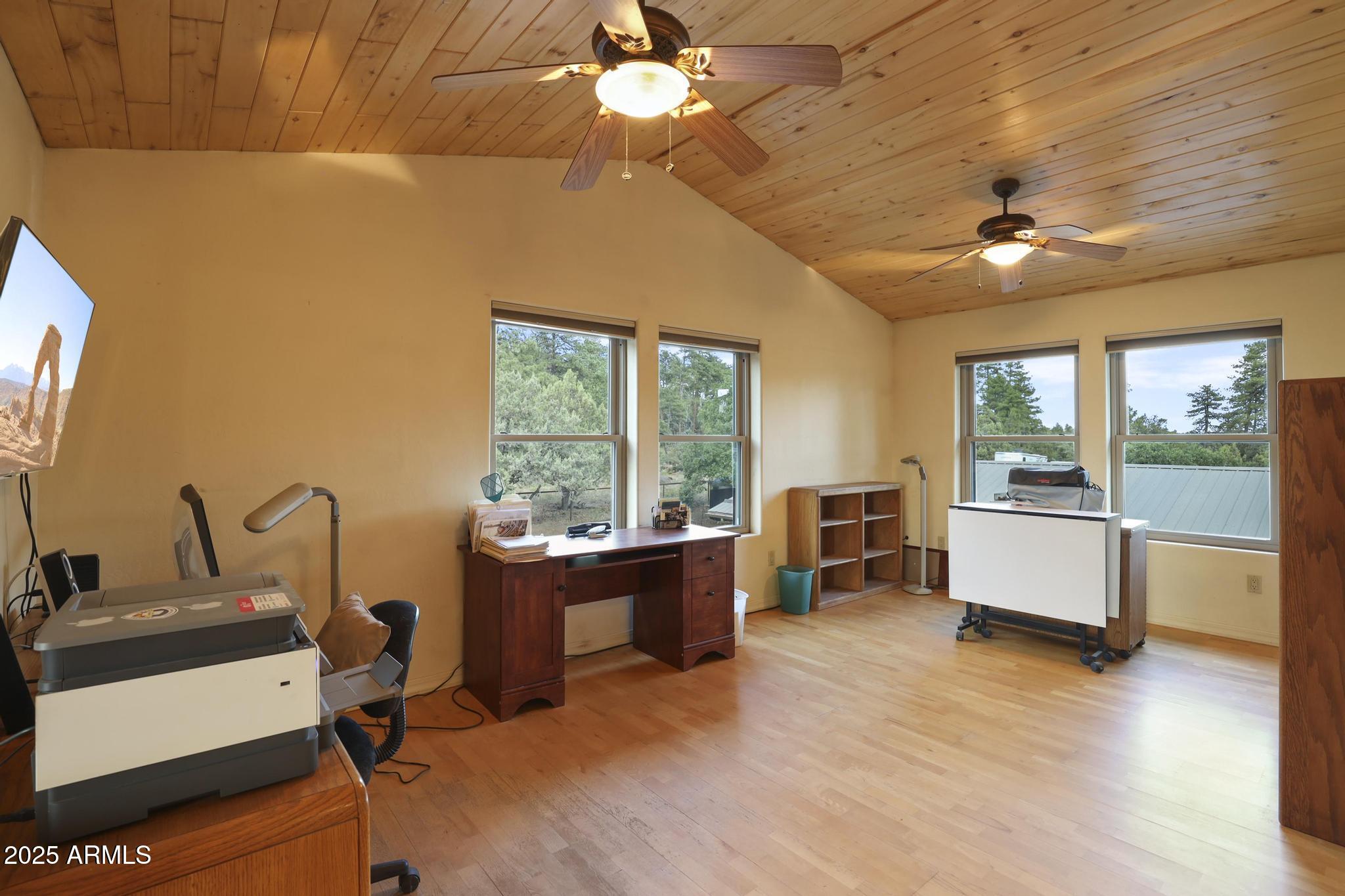 131 West Hunt Ranch Road Pine, AZ 85544 - Photo 21 of 65 a view of workspace with furniture window and wooden floor
