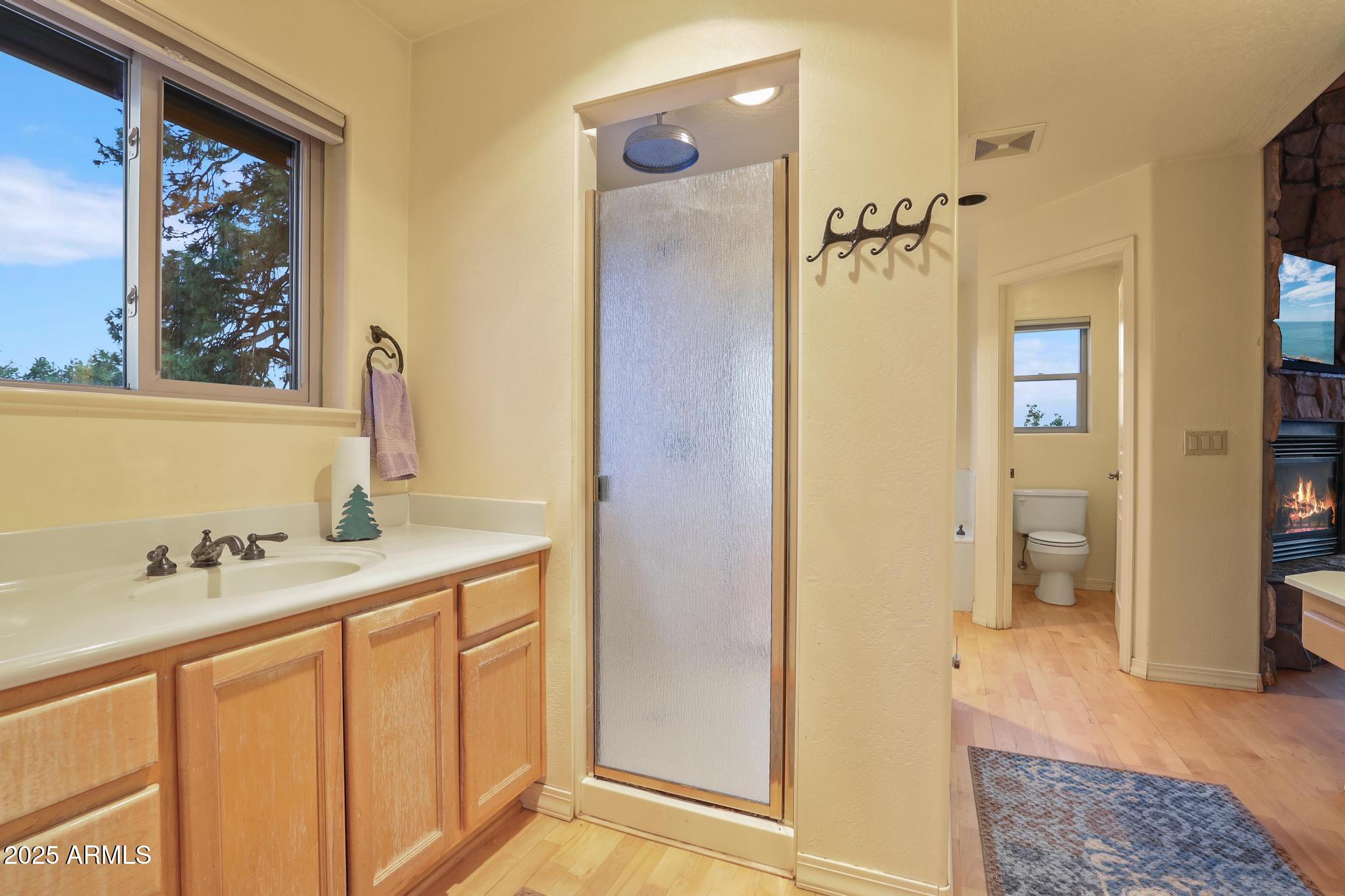 131 West Hunt Ranch Road Pine, AZ 85544 - Photo 25 of 65 a bathroom with a sink and a mirror
