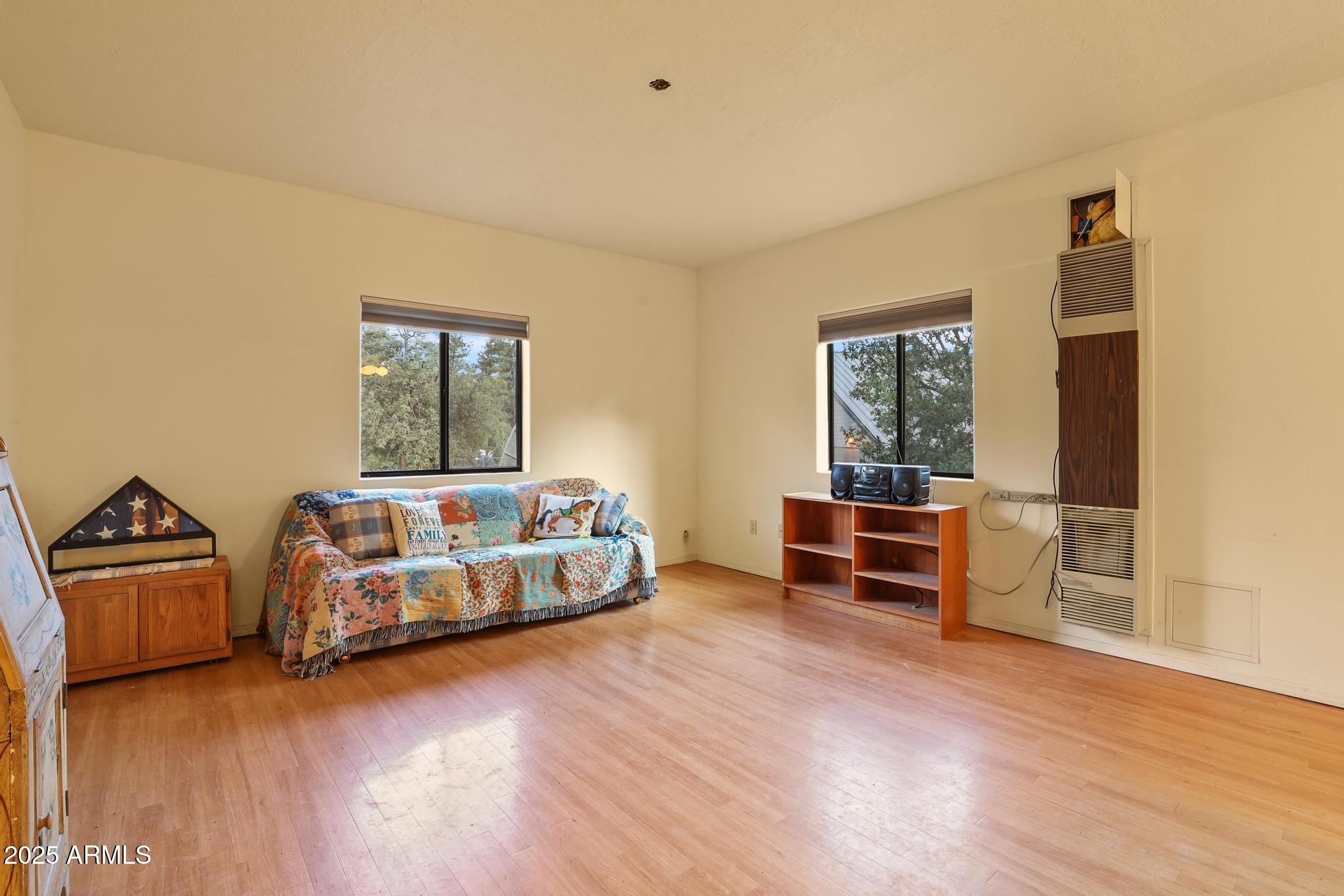 131 West Hunt Ranch Road Pine, AZ 85544 - Photo 29 of 65 a bedroom with furniture and a window