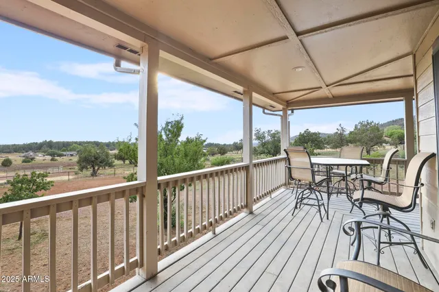 a view of a balcony with wooden floor