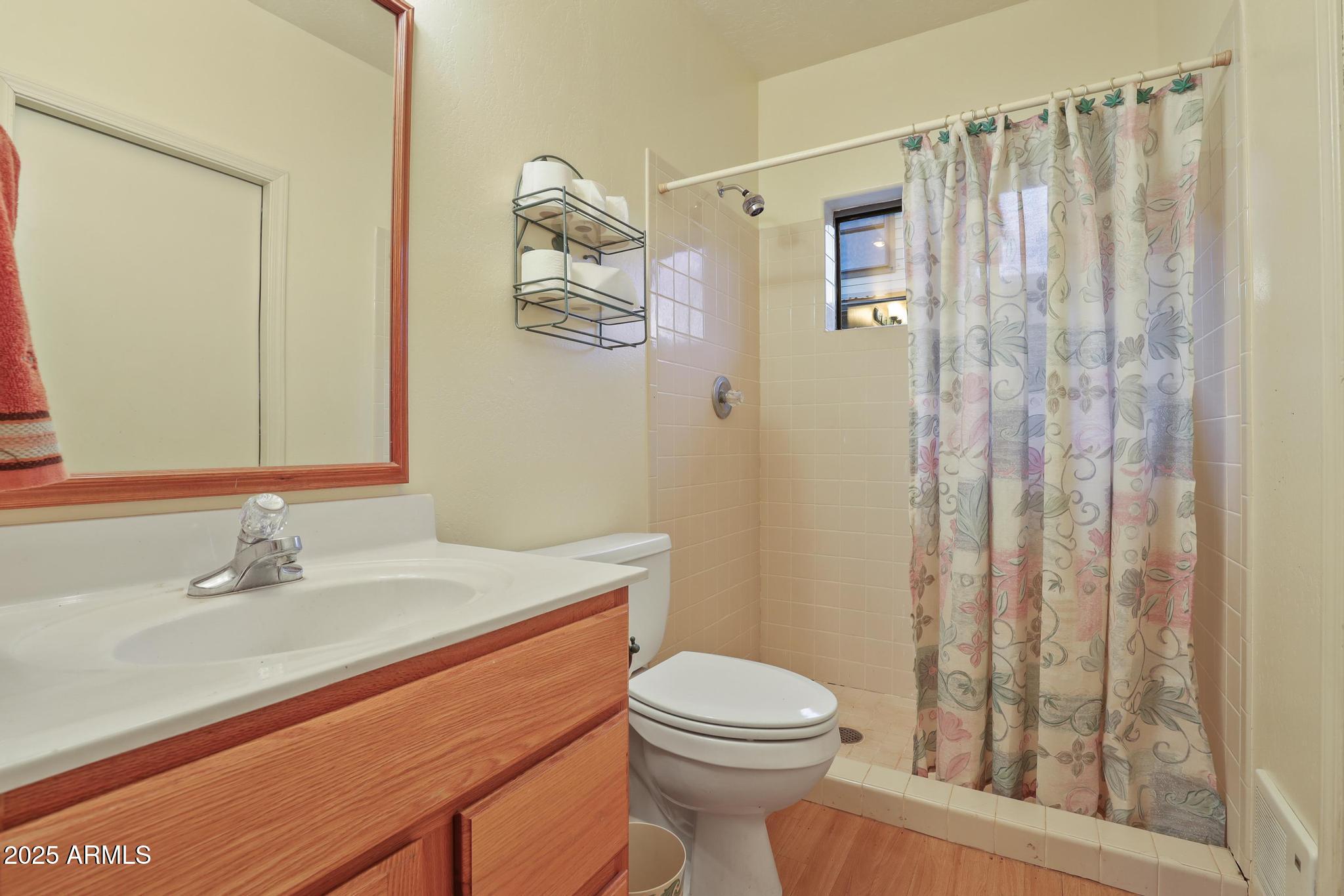 131 West Hunt Ranch Road Pine, AZ 85544 - Photo 31 of 65 a bathroom with a sink a toilet and shower