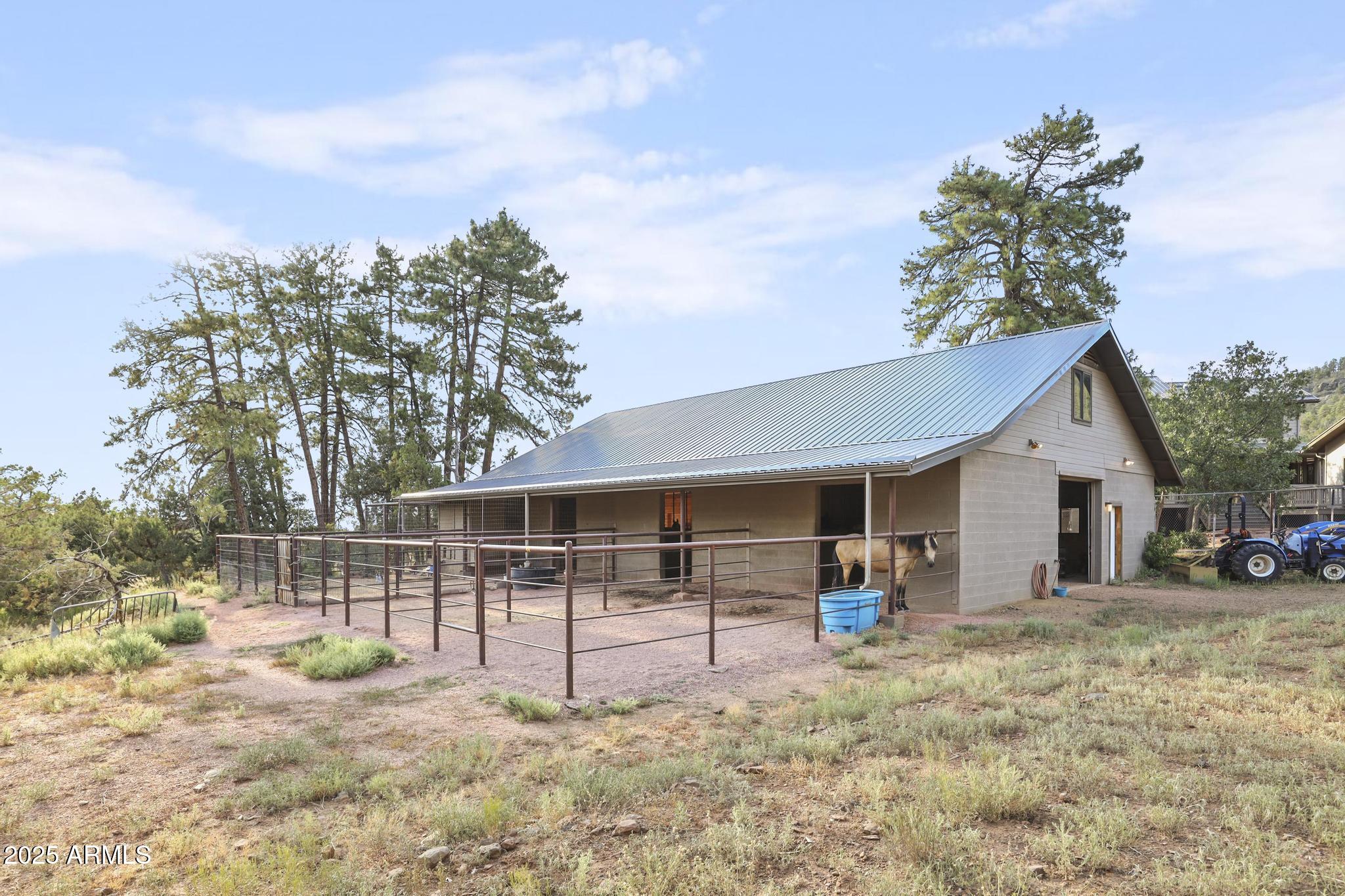 131 West Hunt Ranch Road Pine, AZ 85544 - Photo 35 of 65 a view of a house with backyard porch and sitting area