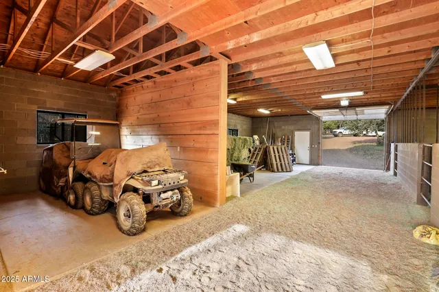 a view of a large house with a big yard and large trees