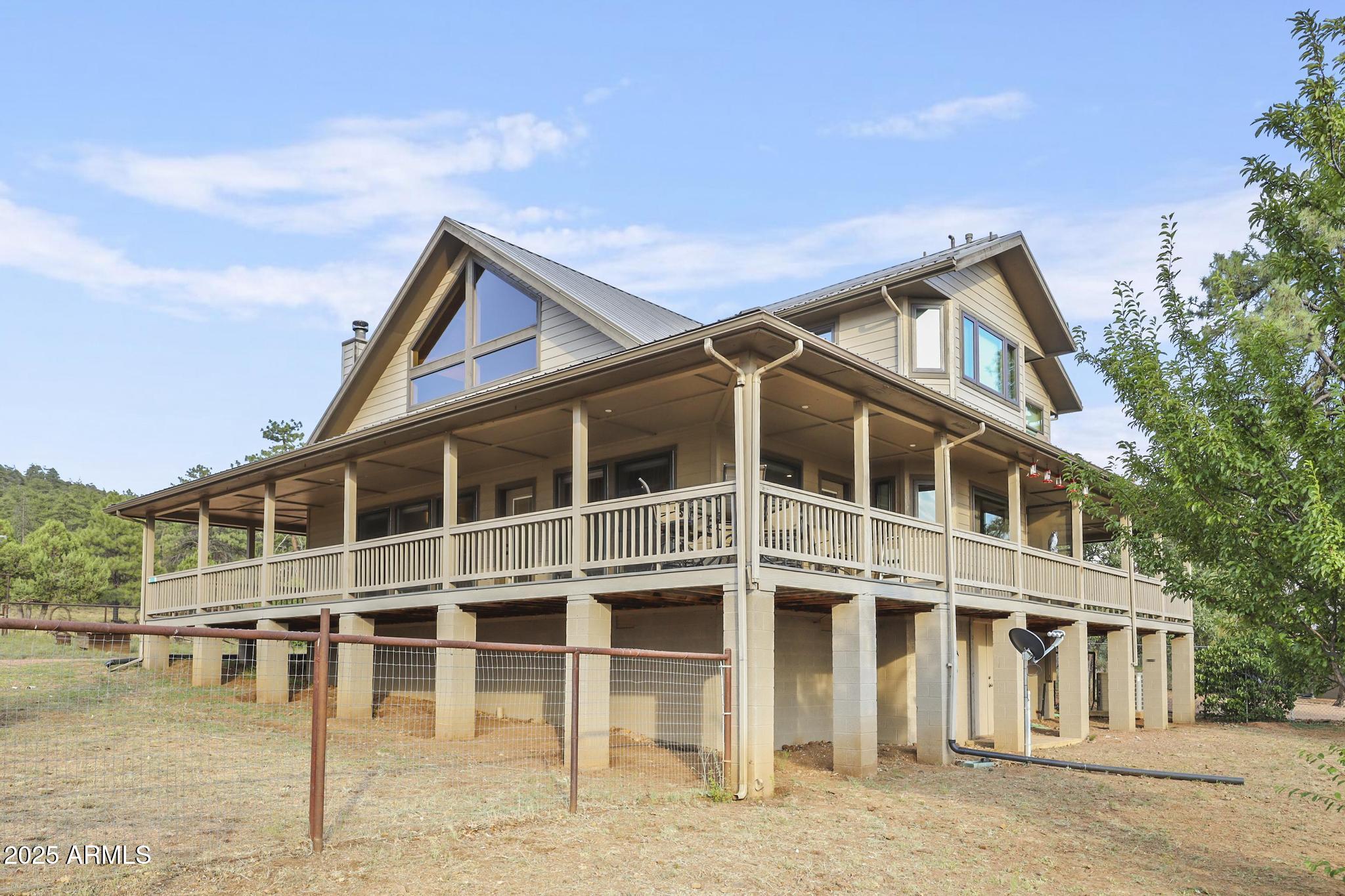 131 West Hunt Ranch Road Pine, AZ 85544 - Photo 42 of 65 a front view of a house with a yard