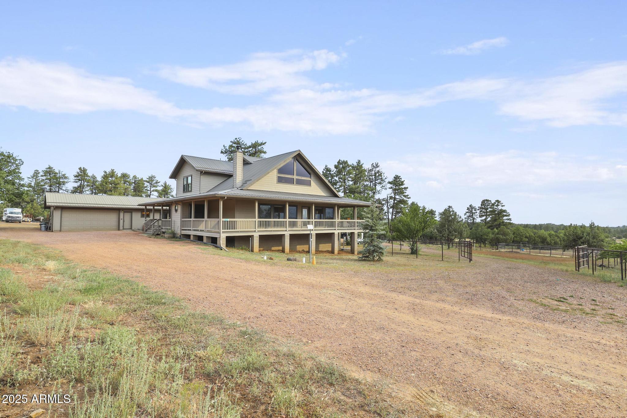 131 West Hunt Ranch Road Pine, AZ 85544 - Photo 45 of 65 a view of a large house with a big yard and large trees