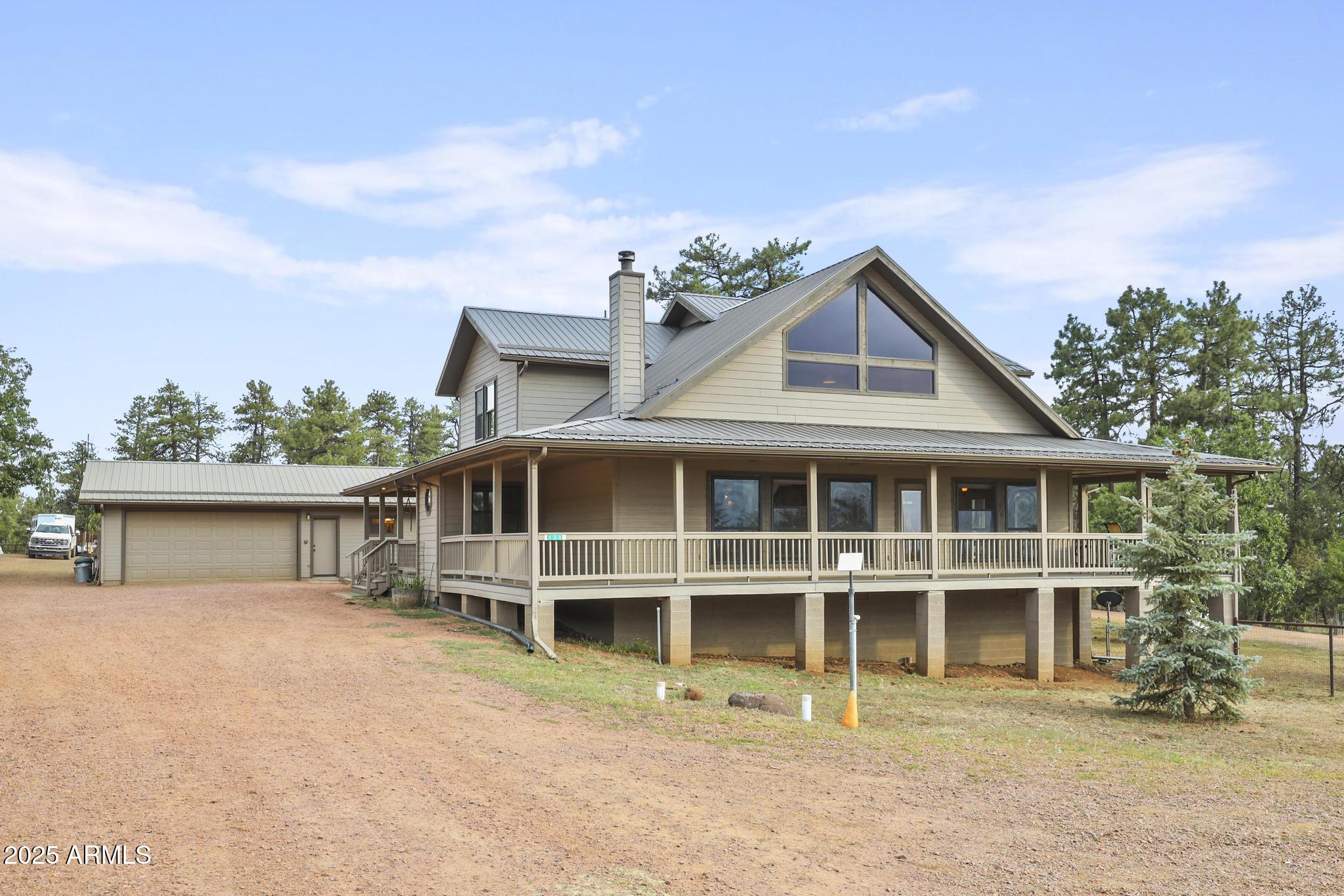 131 West Hunt Ranch Road Pine, AZ 85544 - Photo 46 of 65 a front view of a house with a yard