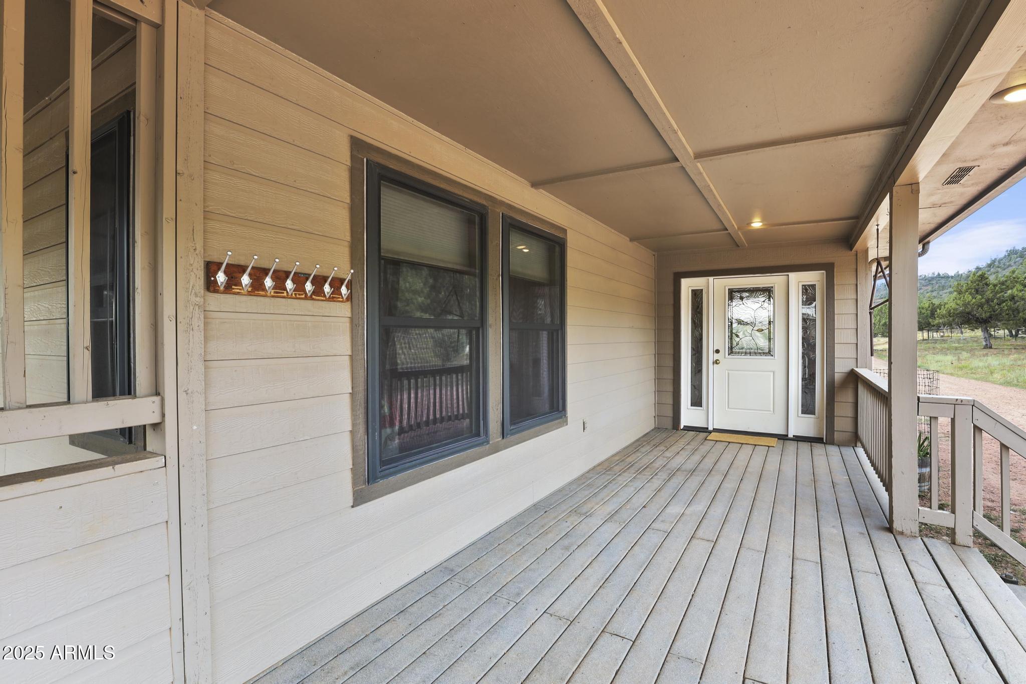 131 West Hunt Ranch Road Pine, AZ 85544 - Photo 5 of 65 a view of a porch with wooden floor and outdoor space
