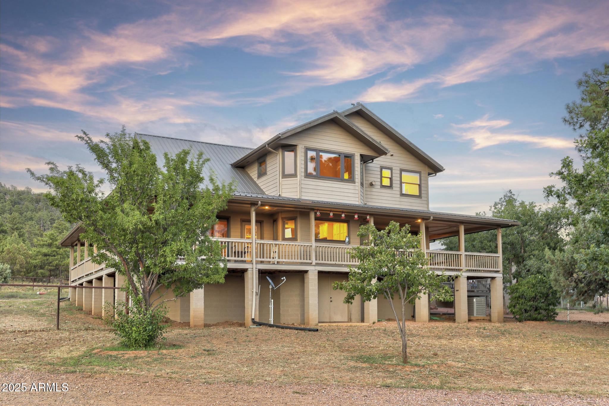 131 West Hunt Ranch Road Pine, AZ 85544 - Photo 55 of 65 a front view of a house with a garden