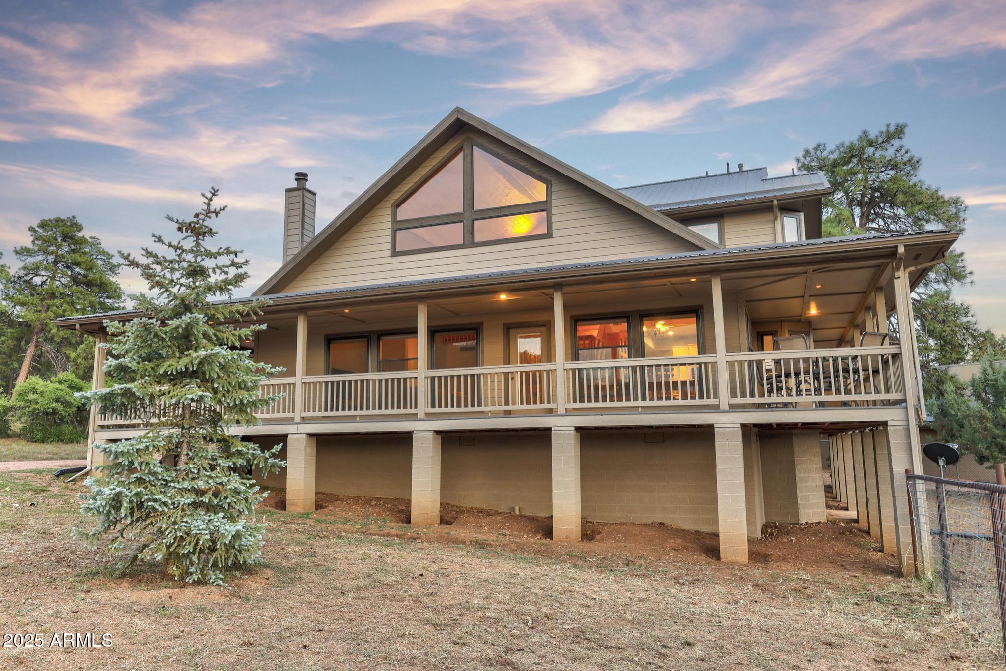 131 West Hunt Ranch Road Pine, AZ 85544 - Photo 56 of 65 a front view of a house with a garden