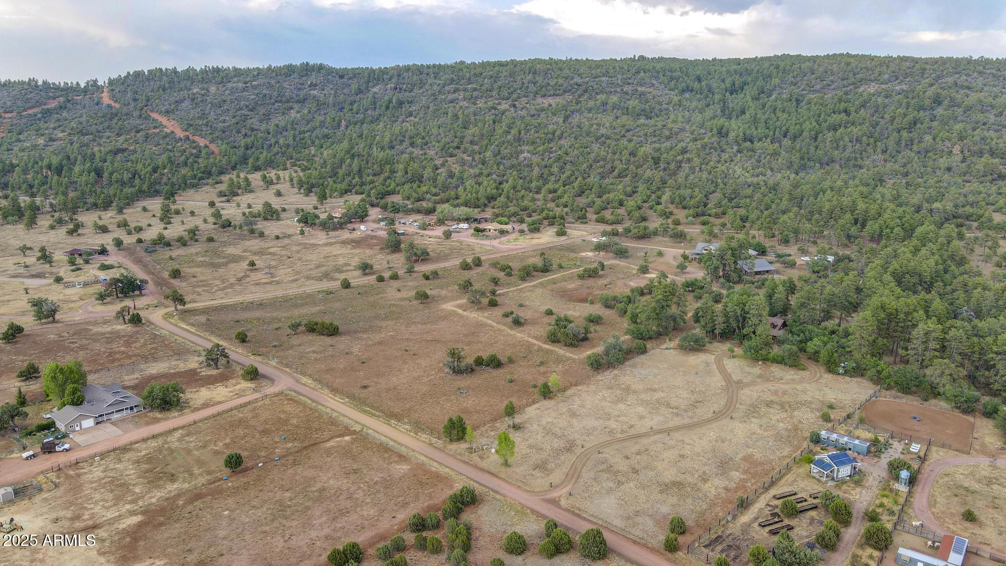 131 West Hunt Ranch Road Pine, AZ 85544 - Photo 64 of 65 a view of a dry yard with wooden fence