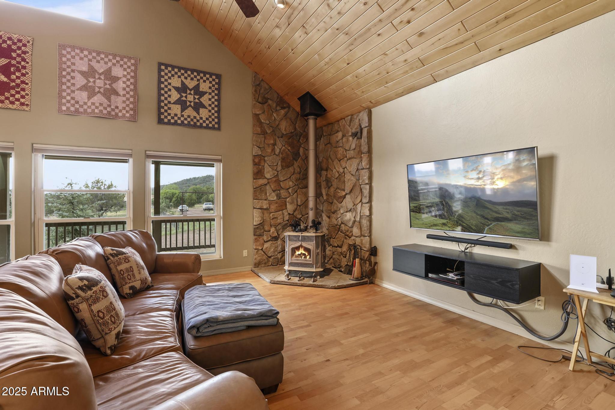 131 West Hunt Ranch Road Pine, AZ 85544 - Photo 7 of 65 a living room with furniture and a flat screen tv