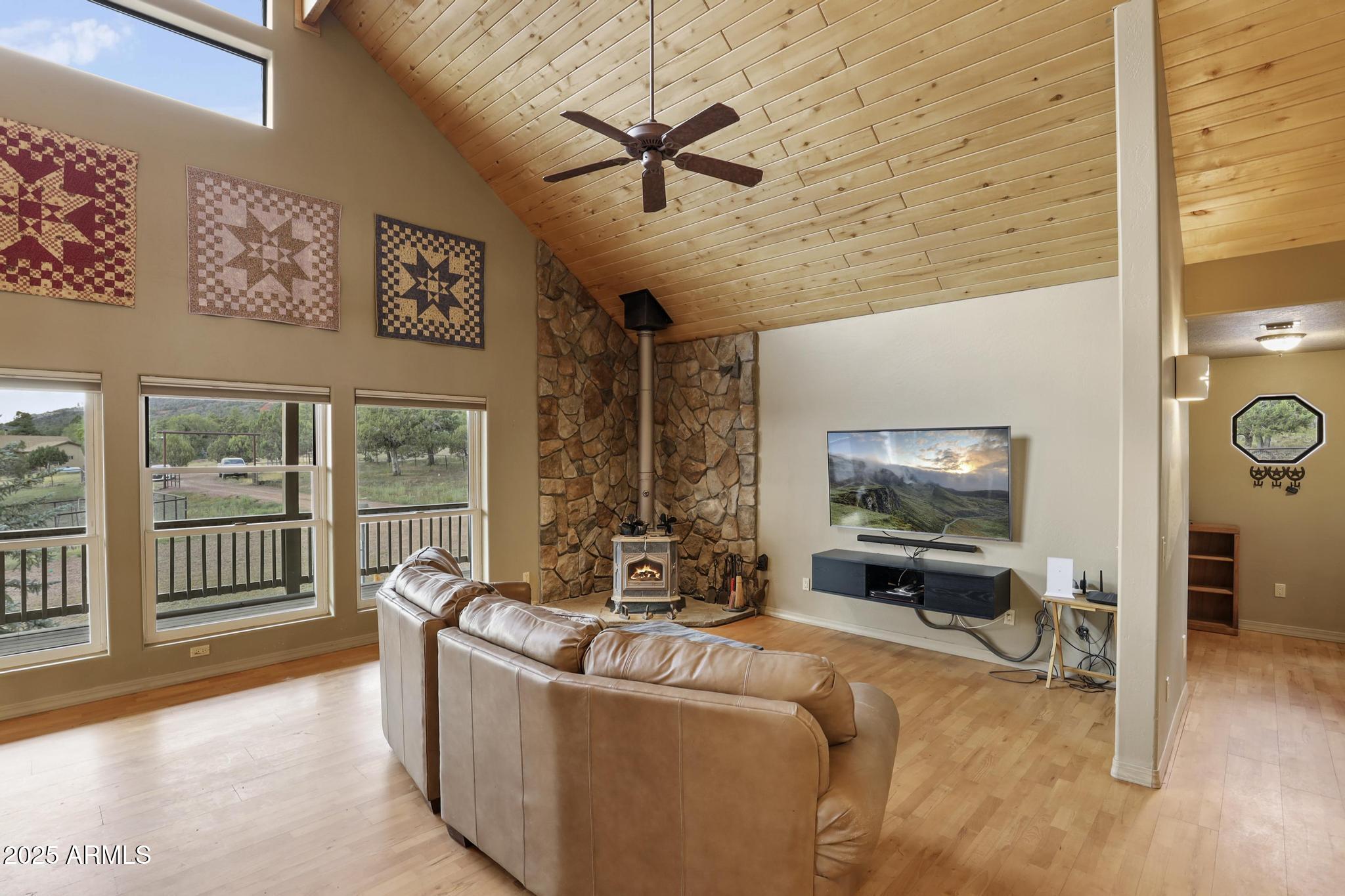 131 West Hunt Ranch Road Pine, AZ 85544 - Photo 8 of 65 a living room with furniture and a flat screen tv