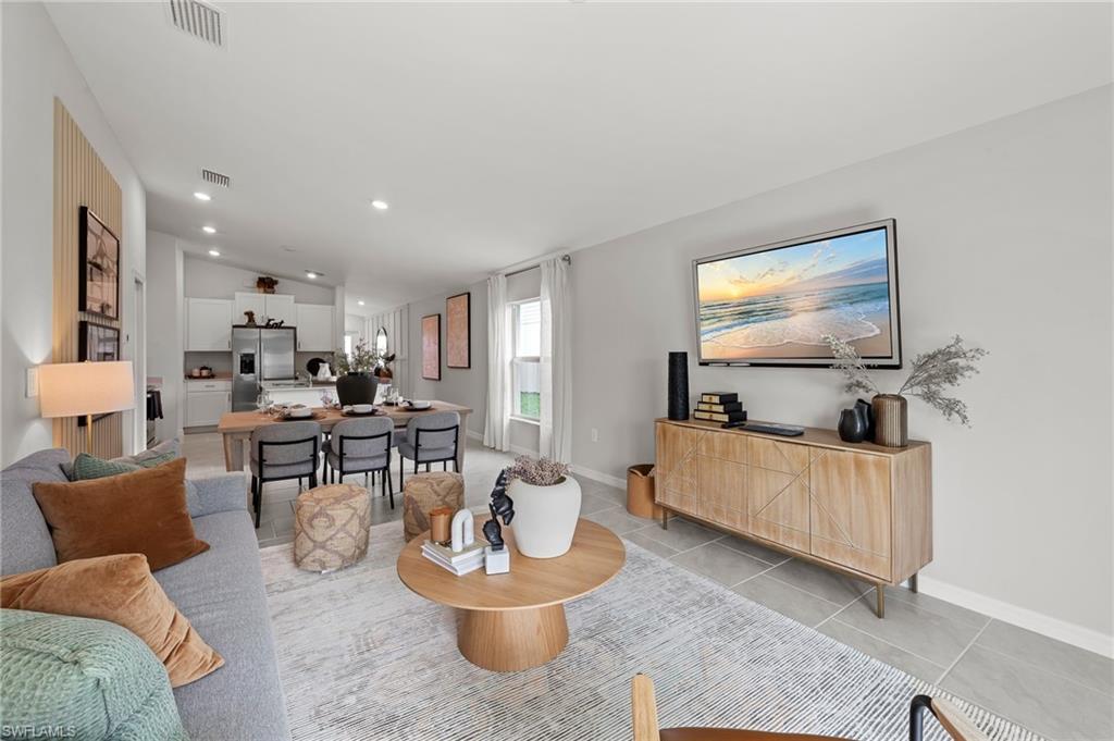 7178 Sugar Pine Way Fort Myers, FL 33966 - Photo 12 of 33 a living room with furniture and a flat screen tv