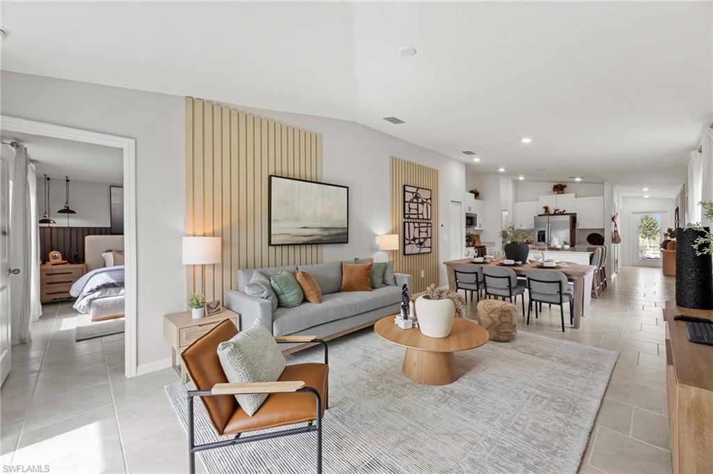 7178 Sugar Pine Way Fort Myers, FL 33966 - Photo 13 of 33 a living room with furniture and a flat screen tv