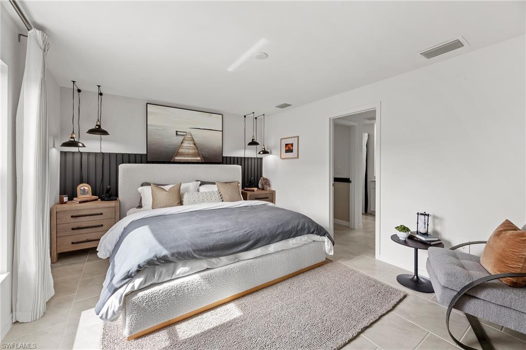 7178 Sugar Pine Way Fort Myers, FL 33966 - Photo 14 of 33 a spacious bedroom with a bed and window