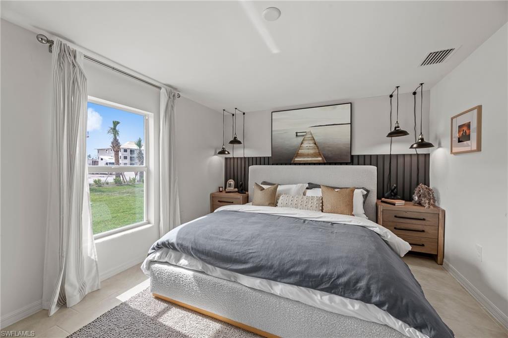 7178 Sugar Pine Way Fort Myers, FL 33966 - Photo 15 of 33 a bedroom with a large bed and a window