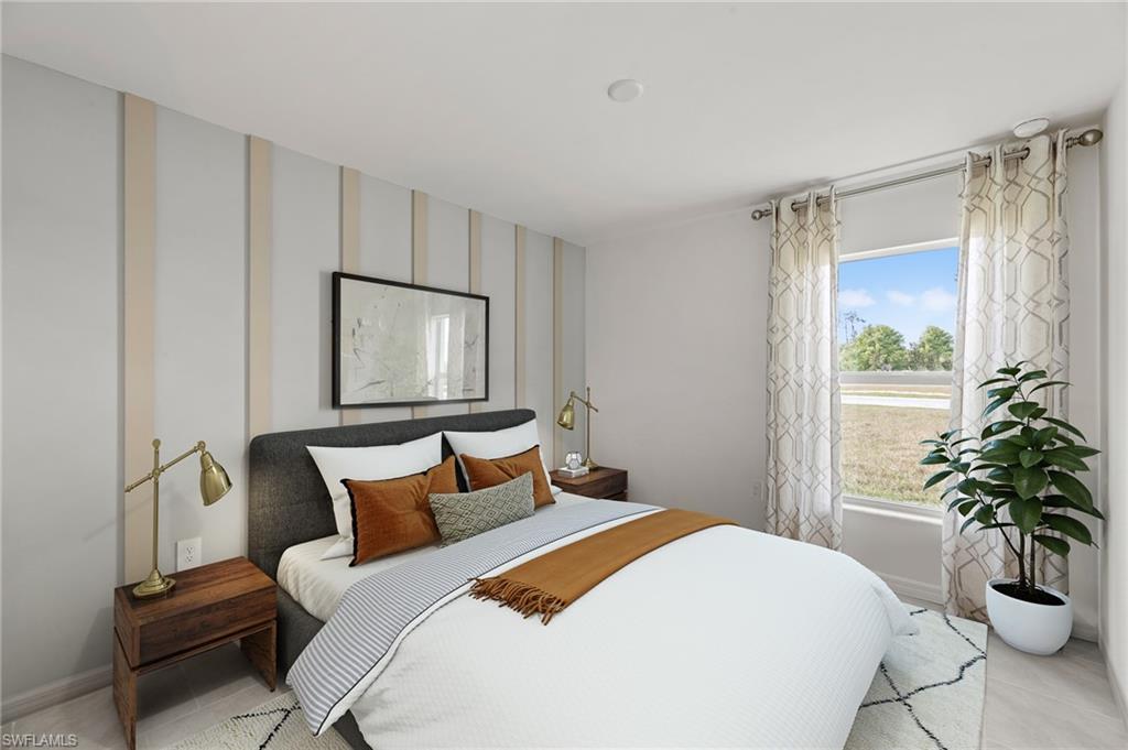 7178 Sugar Pine Way Fort Myers, FL 33966 - Photo 18 of 33 a bedroom with a bed and a potted plant