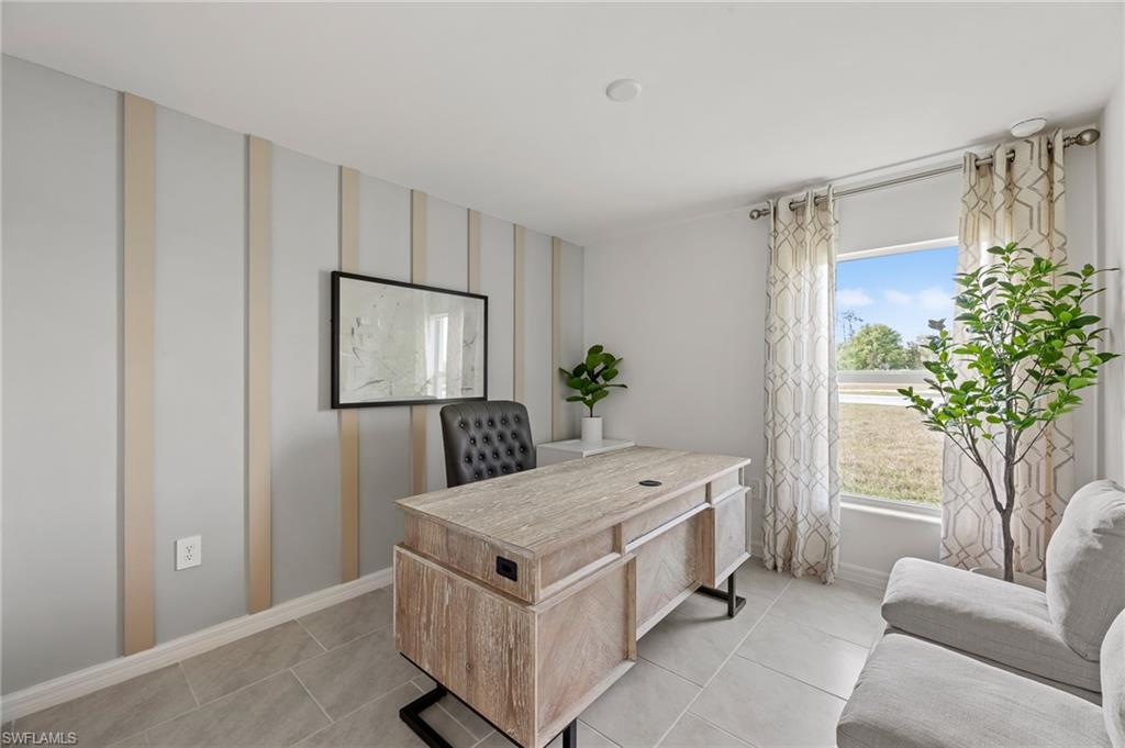 7178 Sugar Pine Way Fort Myers, FL 33966 - Photo 23 of 33 a living room with a potted plant and a table