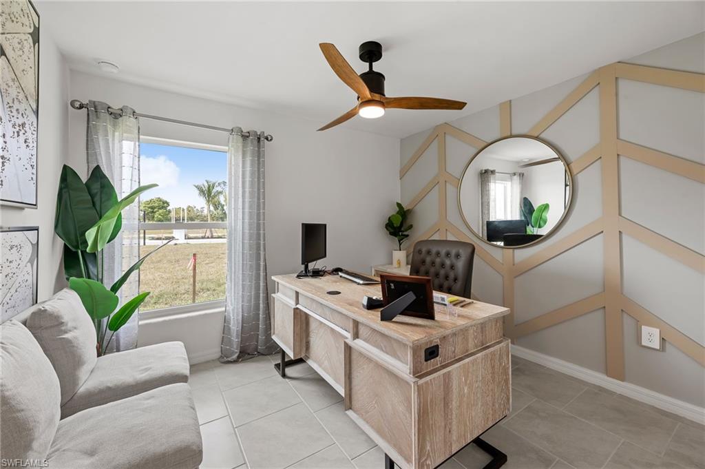 7178 Sugar Pine Way Fort Myers, FL 33966 - Photo 25 of 33 a kitchen with stainless steel appliances granite countertop a stove a window and a couch