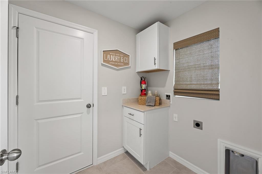7178 Sugar Pine Way Fort Myers, FL 33966 - Photo 27 of 33 a kitchen with a sink and cabinets
