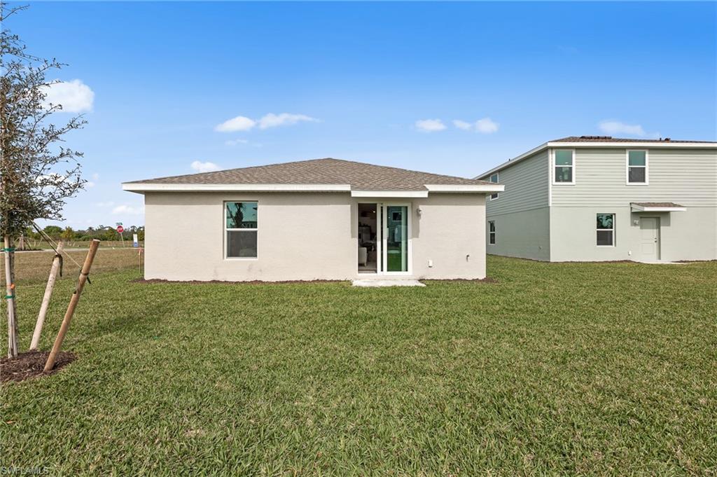 7178 Sugar Pine Way Fort Myers, FL 33966 - Photo 28 of 33 a view of a backyard with plants and a backyard