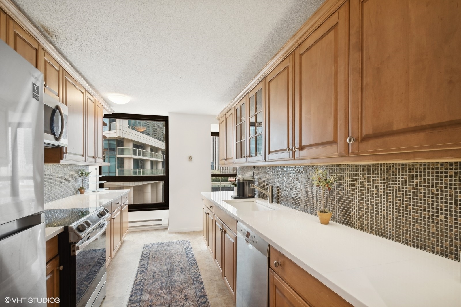 Undisclosed Address Chicago, IL 60601 - Photo 6 of 19 a kitchen with a sink stove and cabinets