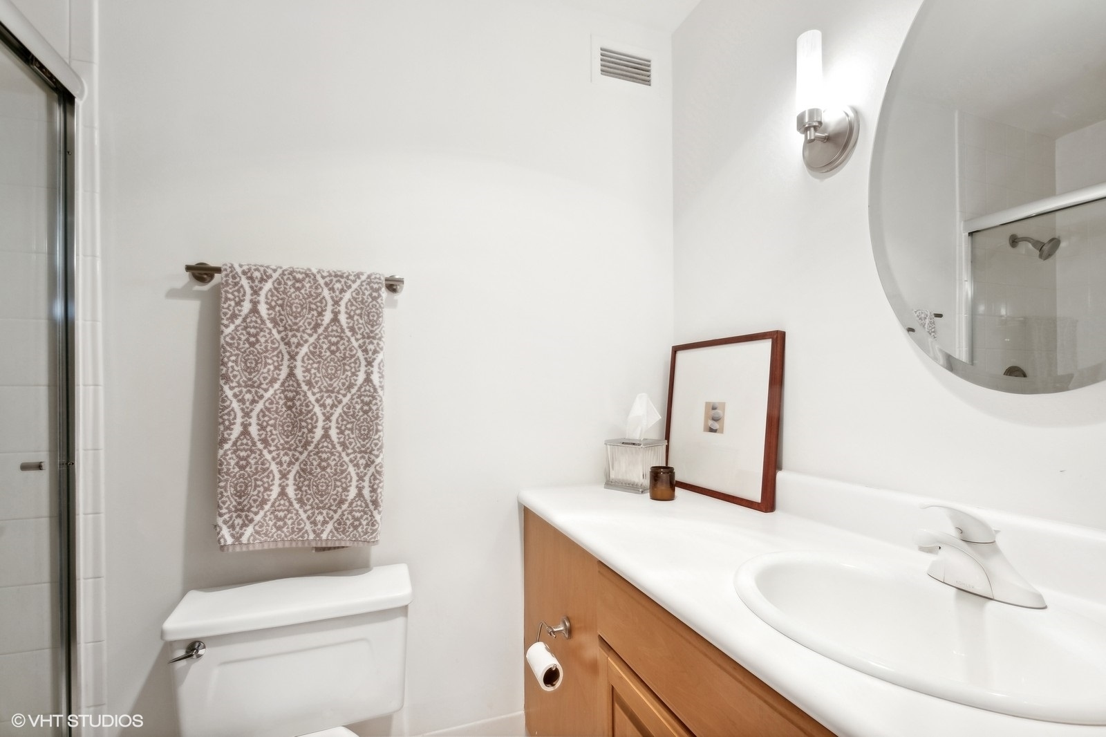 Undisclosed Address Chicago, IL 60601 - Photo 9 of 19 a bathroom with a sink vanity mirror and toilet