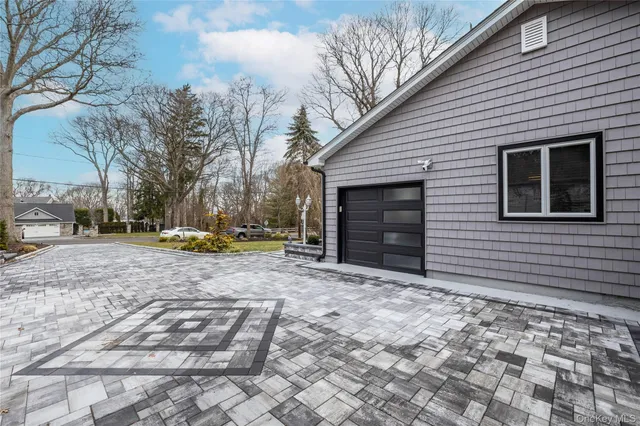 a view of a backyard with a tree