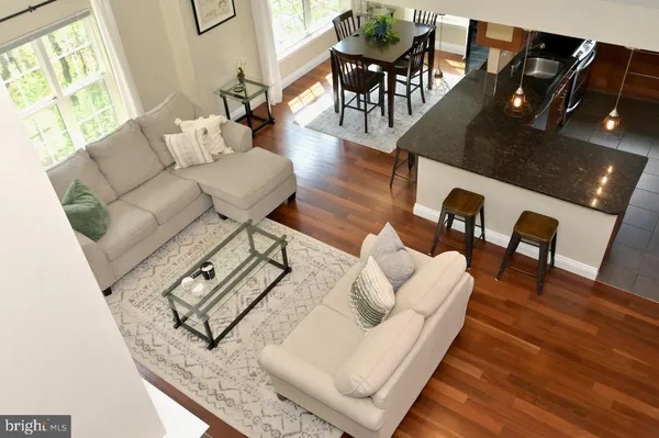a living room with furniture fireplace and a window