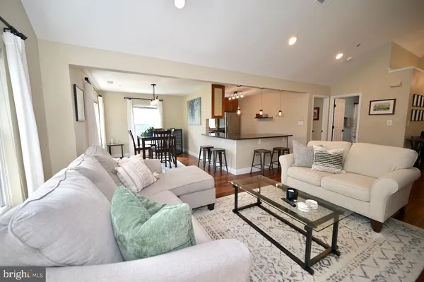 a living room with furniture and a table
