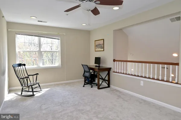 a view of a storage & utility room with dryer and washer