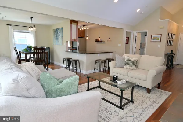 a living room with furniture fireplace and a flat screen tv
