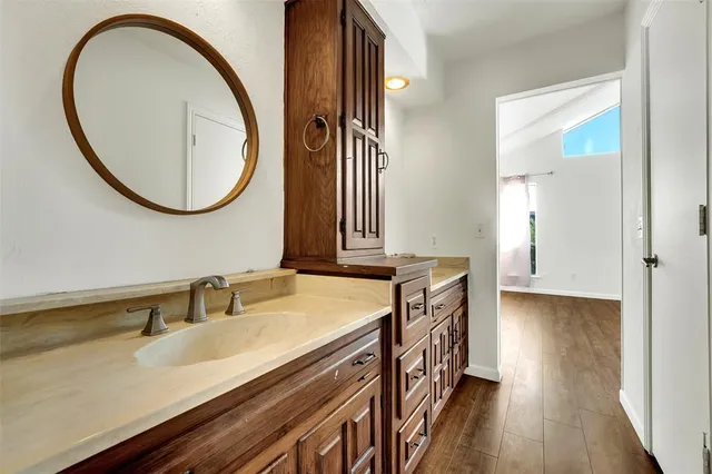 a bathroom with a bathtub and window