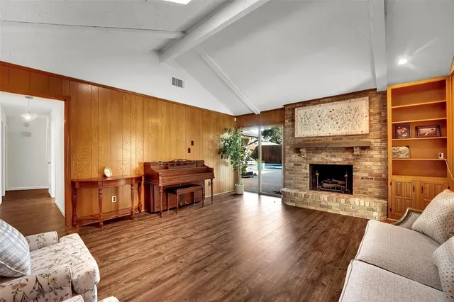 a bedroom with furniture and a piano