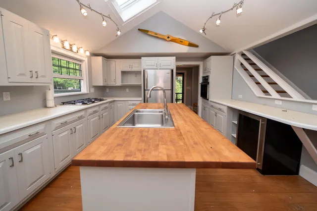 a bathroom with a sink and a window
